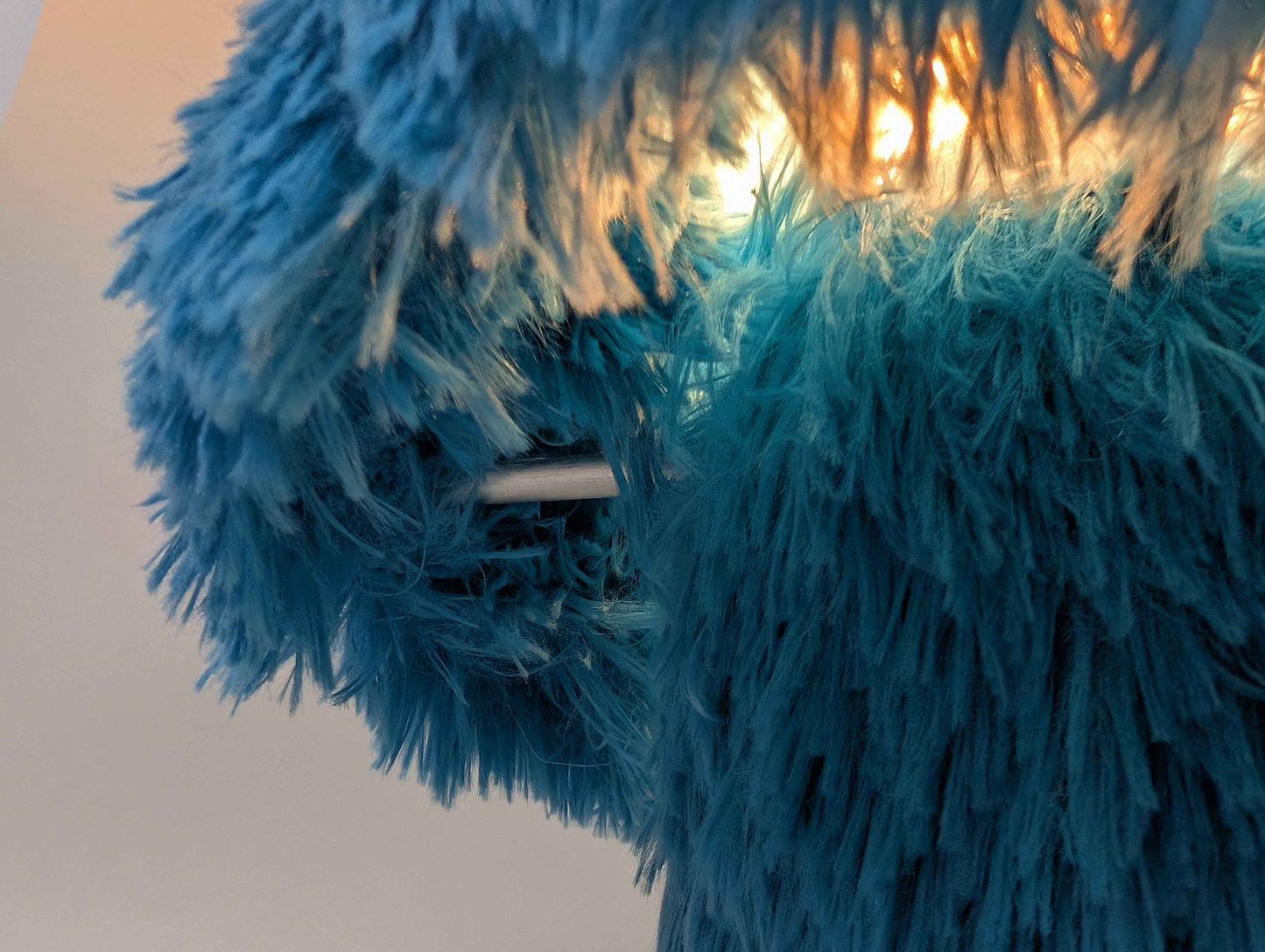 Cookie table lamp styled on a side table in a living room