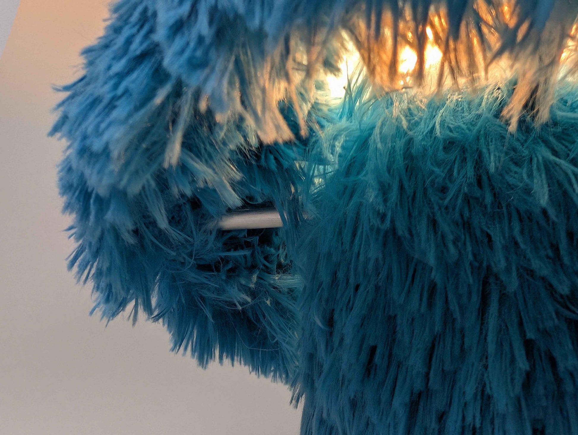 Cookie table lamp styled on a side table in a living room