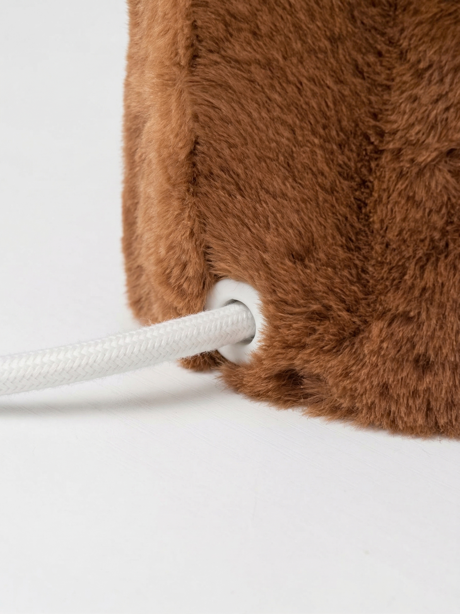 Close-up of Momo's faux fur texture and jesmonite base