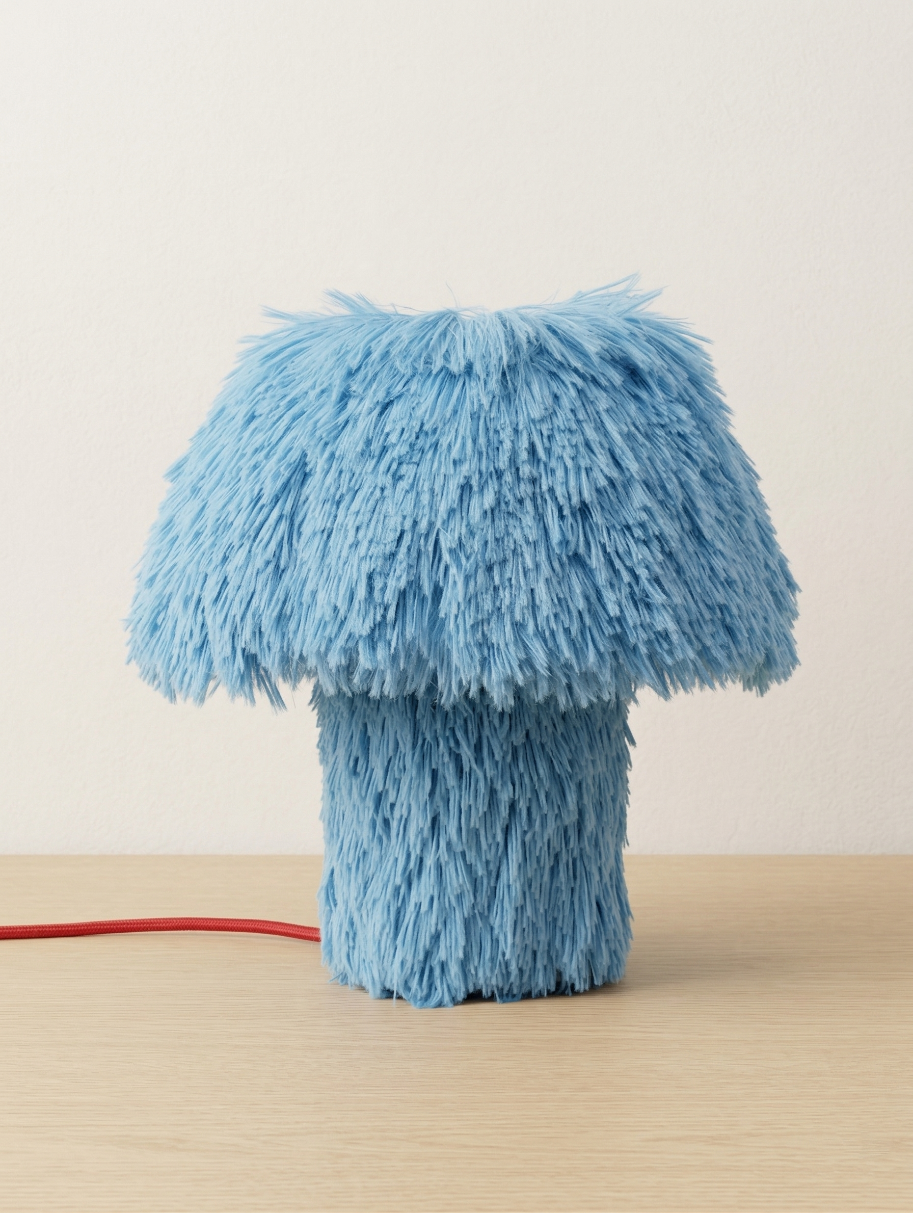 Cookie sculptural table lamp on a light studio background