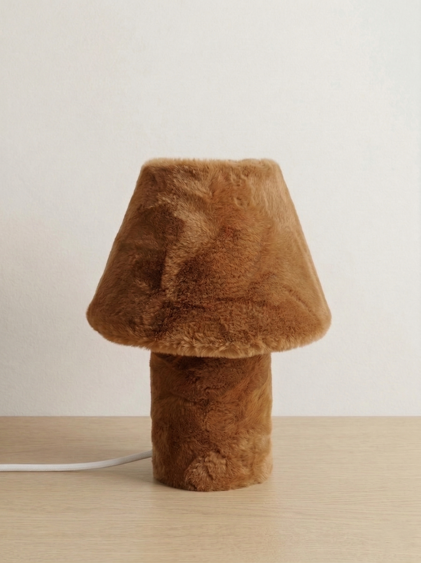 Momo sculptural table lamp on a light studio background