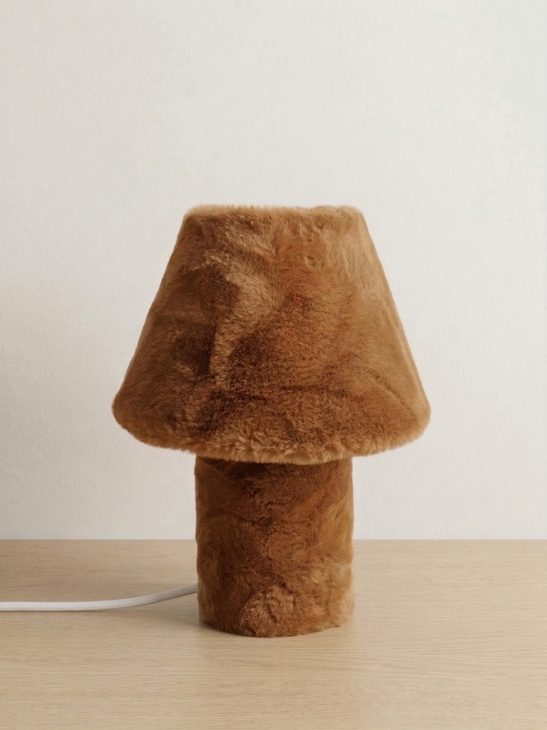 Momo sculptural table lamp on a light studio background