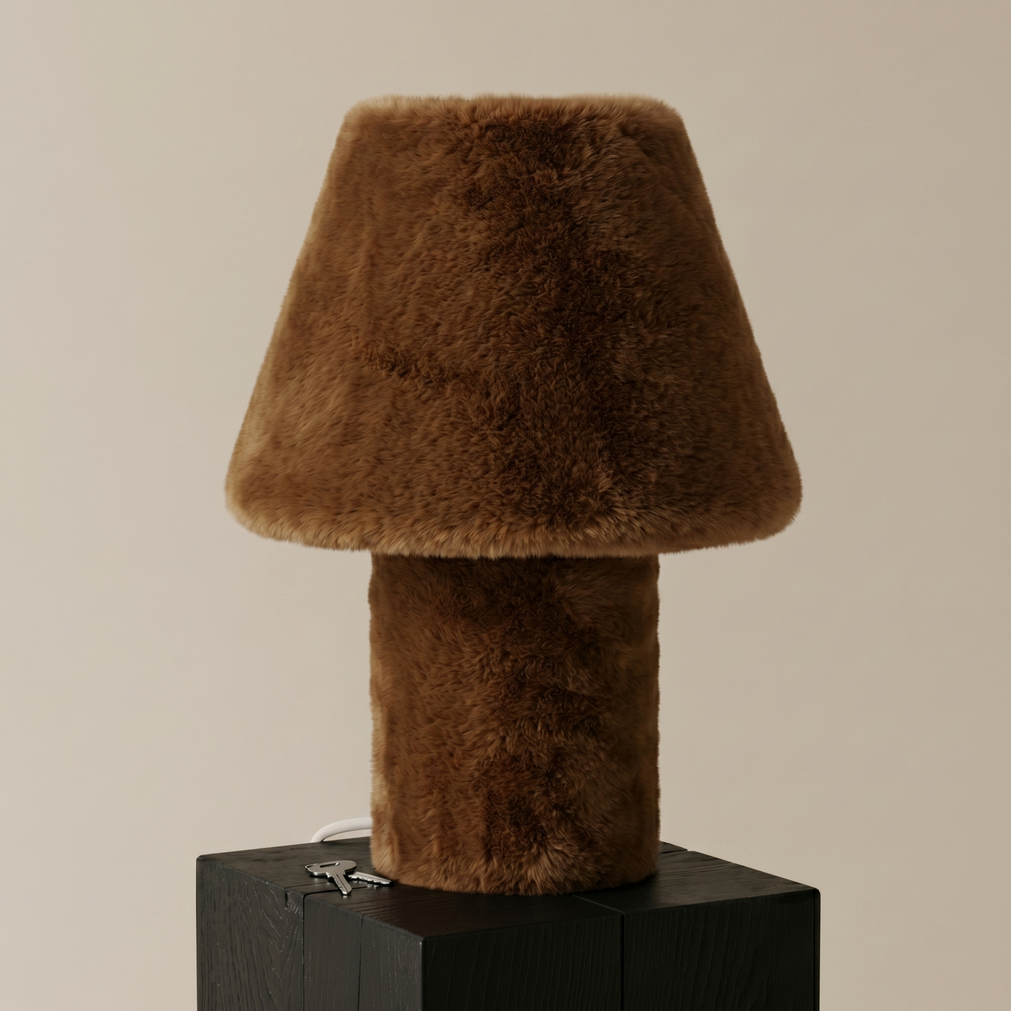 Momo table lamp with soft faux fur shade, front studio view