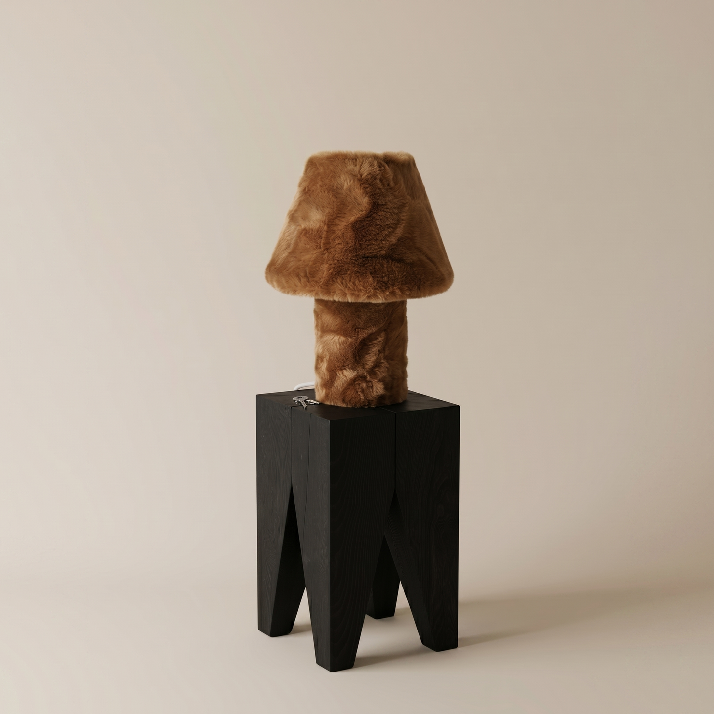 Momo table lamp illuminated, close angle showing warm ambient glow