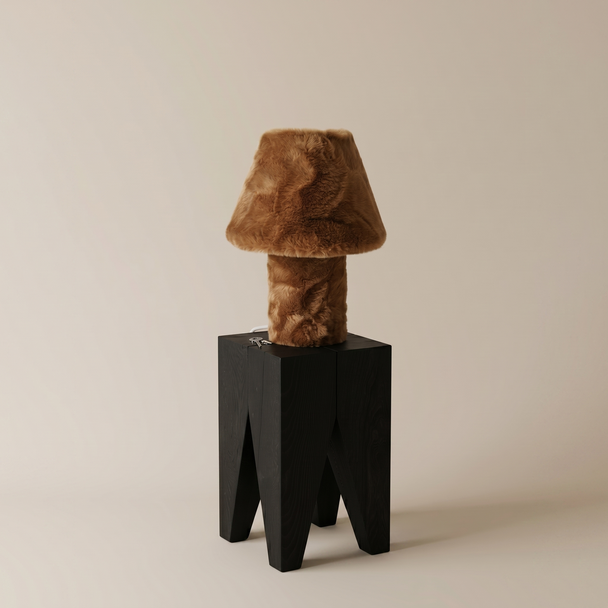 Momo table lamp illuminated, close angle showing warm ambient glow